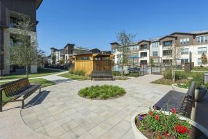 a patio with two benches and a gazebo at Landing Incredible 1BD Pool Gym in Katy