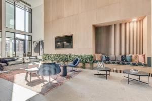 a living room with a couch and chairs and tables at Landing Stylish 2BD Gym Pool in Colorado Springs
