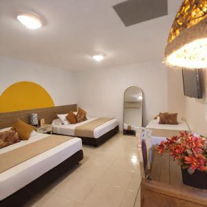 En eller flere senge i et værelse på Casa de Pinos Hotel Boutique