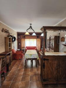 a living room with a table and a couch at Lo de Capra! in Santa Clara del Mar