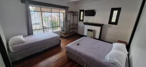 Postel nebo postele na pokoji v ubytování Hostal Valle Norte + 35 fotografií