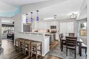 a kitchen with a table and chairs and a counter top at 1973 Salamanca St in Navarre