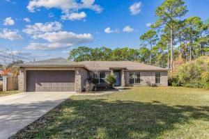 a brick house with a garage at 1973 Salamanca St in Navarre