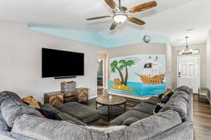 a living room with a couch and a flat screen tv at 1973 Salamanca St in Navarre