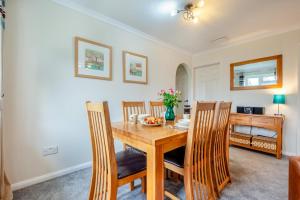 a dining room with a wooden table and chairs at 3 Bed in St. Merryn oc-p00114 in Saint Merryn +17 photos