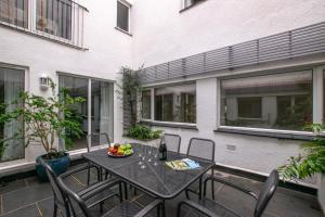 a patio with a table and chairs on a balcony at 3 Bed in Padstow oc-p00793 in Padstow
