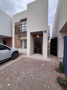 a car parked in front of a house at Residencia Flores in Hermosillo