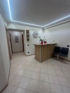 an office with a desk and two chairs in a room at Kalgheros in Agrigento