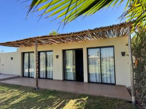 a small house with a wooden porch at Bungalow in Marrakech in Marrakesh