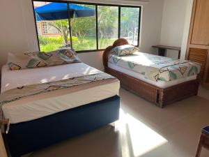 En eller flere senge i et værelse på Cabaña - Condominio El Rincón del Edén + 50 billeder