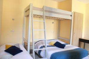 Postel nebo postele na pokoji v ubytování La loge des Hermones