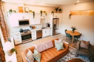 a living room with a couch and a table at Historic 2BR suite in Halifax w Free Parking in Halifax