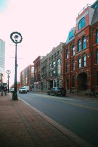 a city street with buildings and cars on the road at Historic 2BR suite in Halifax w Free Parking in Halifax