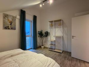 Postel nebo postele na pokoji v ubytování Perfekt für 2-4! Küche Garage Flughafen Nespresso