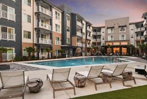 an image of a swimming pool at a apartment complex at Landing Modern 3BD Gym Rooftop Lounge in Bellview