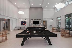 a billiard room with a pool table in it at Landing Modern 3BD Gym Rooftop Lounge in Bellview