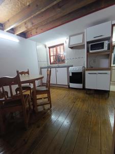 Kuchyň nebo kuchyňský kout v ubytování Cabaña La Sonrisa