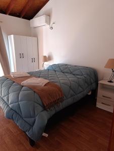 Postel nebo postele na pokoji v ubytování Cabaña La Sonrisa + 6 fotografií