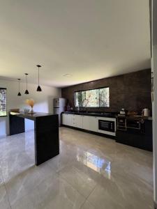 Køkken eller tekøkken på Recanto Rivière + 30 billeder