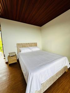 En eller flere senge i et værelse på Cabaña americana