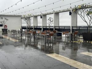 a banquet hall with tables and chairs in the rain at Nasai Retreat Studio in H Elite Design Building in Kota Bharu