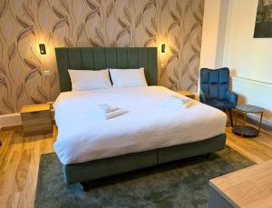 เตียงในห้องที่ Byzanthin rooms