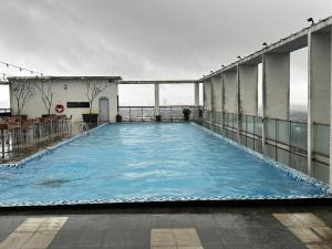 a large swimming pool on top of a building at Nasai Retreat Studio in H Elite Design Building in Kota Bharu