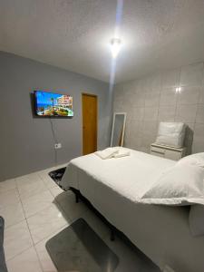 TV a/nebo společenská místnost v ubytování Apartamento completo conforto e ótima localização