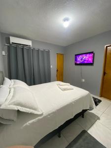 Postel nebo postele na pokoji v ubytování Apartamento completo conforto e ótima localização