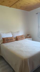 En eller flere senge i et værelse på Casa de campo Emmanuel