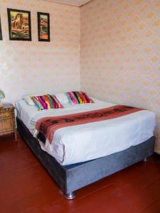 a bedroom with a bed in a room at Casona Cruz Verde in Arequipa