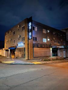 a building with a sign on the side of it at San Juliano Studios in Foz do Iguaçu