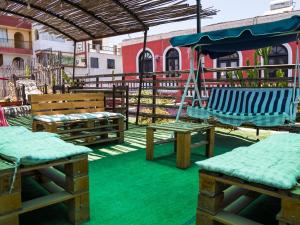 a playground with two chairs and a swing at Casona Cruz Verde in Arequipa +21 photos