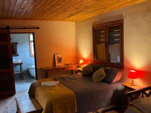 En eller flere senge i et værelse på Morada Canto do Sol