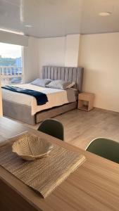 En eller flere senge i et værelse på CASA CIELO Quindio