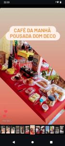 a table with food on a red table cloth at Casa da Piscina in Maceió