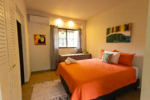 En eller flere senge i et værelse på Tortuga HBH