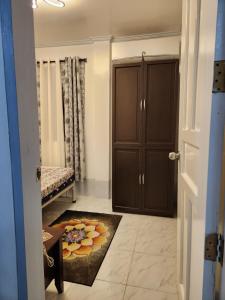 a door leading to a room with a bedroom at Teachers Home in Panong