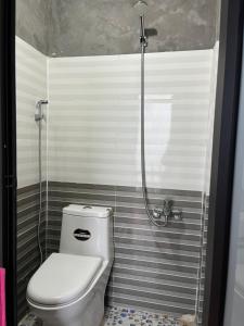 a bathroom with a toilet and a shower at Chi Homestay in Sapa