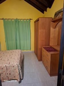 En eller flere senge i et værelse på Casa Picoco