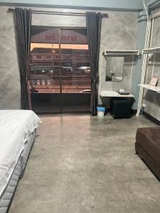 a bedroom with a bed and a sink and a mirror at Sea Skyline family in Sattahip