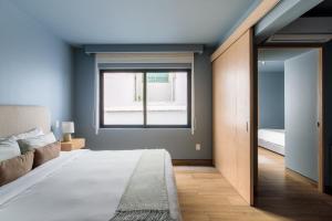 Giường trong phòng chung tại TONALA By Mr W