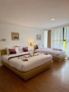 En eller flere senge i et værelse på Neptuna Kata Beach