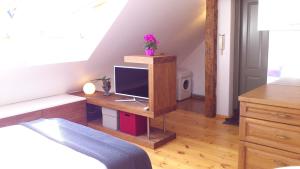 a bedroom with a desk with a computer on it at Old Town Riga in Rīga