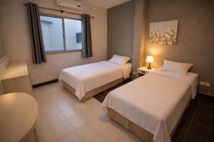 Posteľ alebo postele v izbe v ubytovaní Shalom Center chaweng Samui