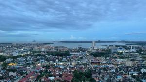 an overhead view of a city with a river and buildings at Dewi's Pollux in Batam Center