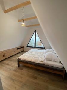 Giường trong phòng chung tại Chata Eliáš