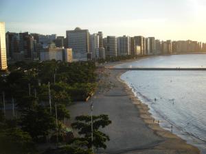 a beach in front of a city with tall buildings at Fortaleza 703--Fortaleza 713 in Fortaleza