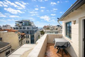 a balcony with a table and a view of the city at Hotel Pera Capitol - Taksim & İstiklal in Istanbul