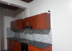 Køkken eller tekøkken på Nyamata City View Apartments